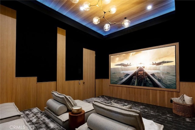 home theater with wood walls