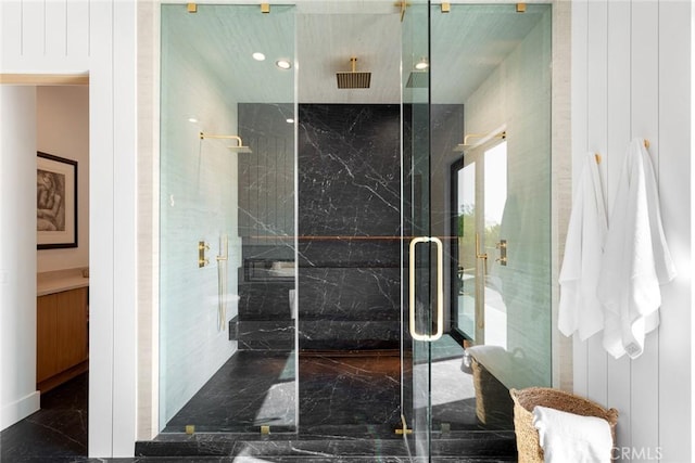 bathroom with a shower with door