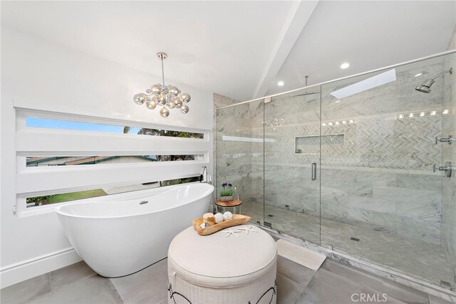 bathroom with tile patterned floors, a chandelier, and separate shower and tub