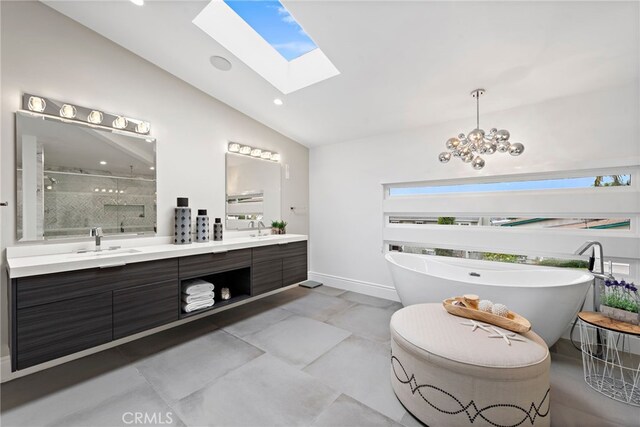 bathroom with vanity, a chandelier, separate shower and tub, and vaulted ceiling