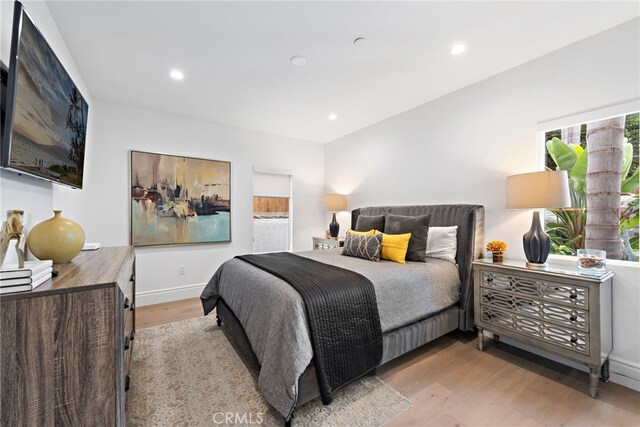 bedroom with light wood-type flooring