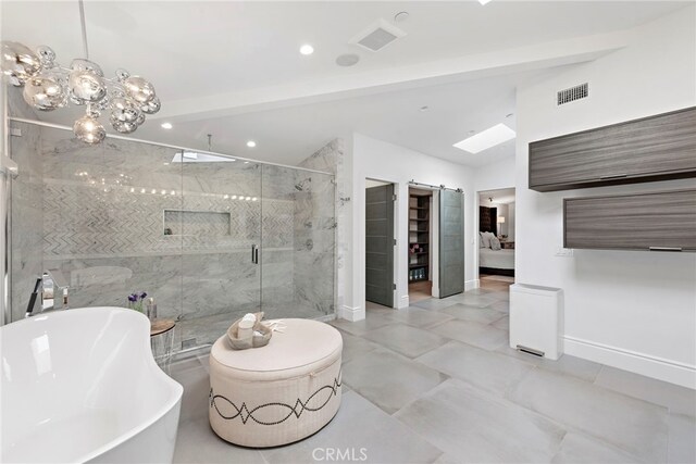 bathroom with separate shower and tub and vaulted ceiling with skylight