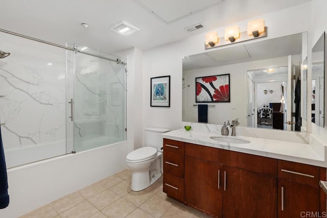 full bathroom featuring shower / bath combination with glass door, vanity, tile patterned flooring, and toilet