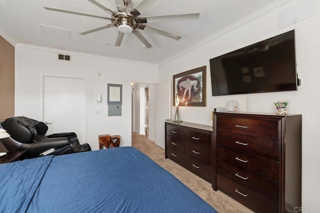 carpeted bedroom featuring ceiling fan and crown molding