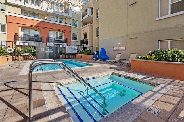 view of pool featuring a hot tub