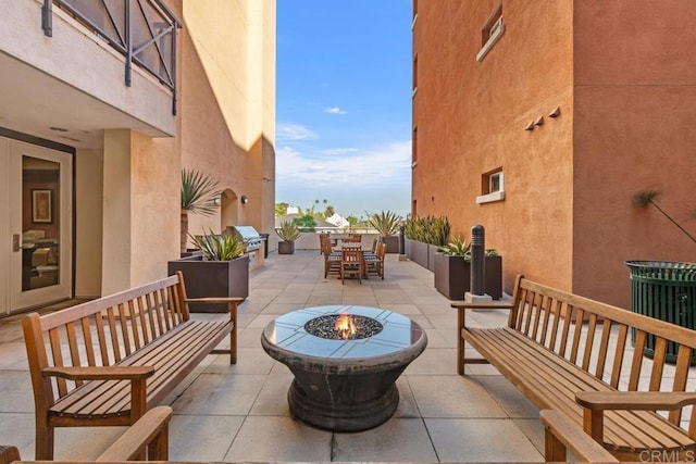 view of patio featuring a fire pit