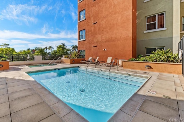 view of pool featuring a patio