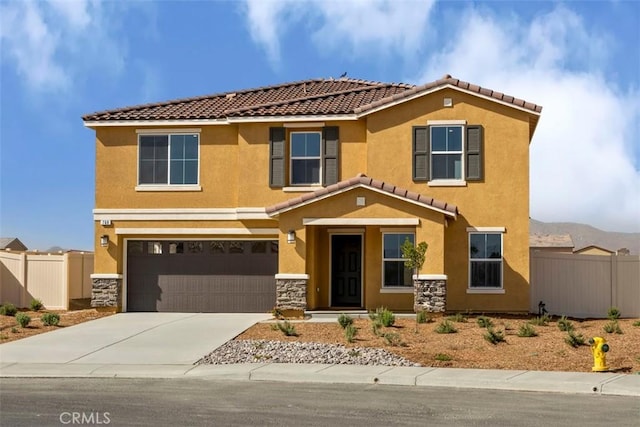 mediterranean / spanish-style house with a garage