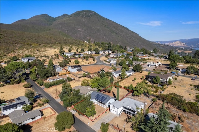 birds eye view of property featuring a mountain view