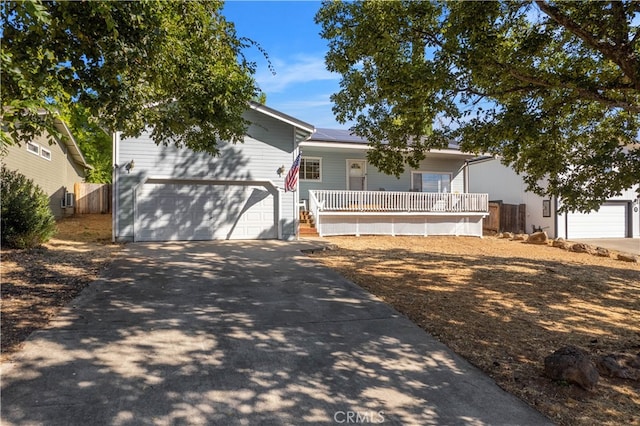 view of front of home with a porch and a garage