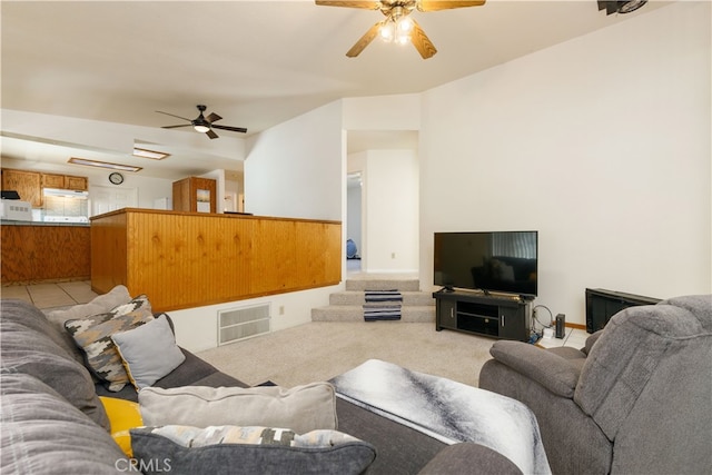 living room featuring light carpet and ceiling fan