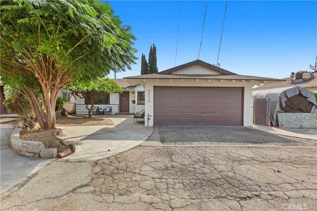 single story home featuring a garage