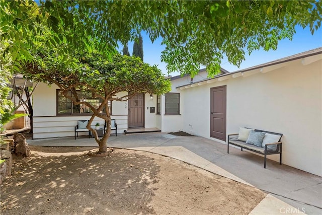 property entrance with a patio