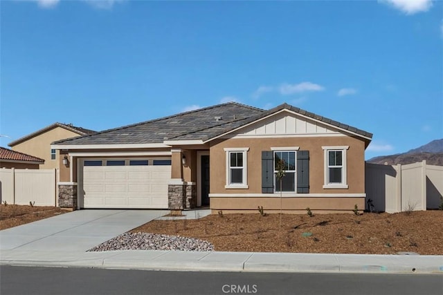 view of front of house featuring a mountain view and a garage