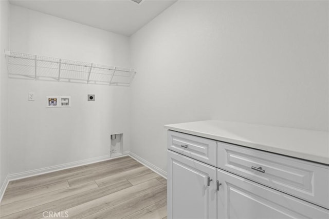 clothes washing area with cabinets, washer hookup, hookup for an electric dryer, and light wood-type flooring