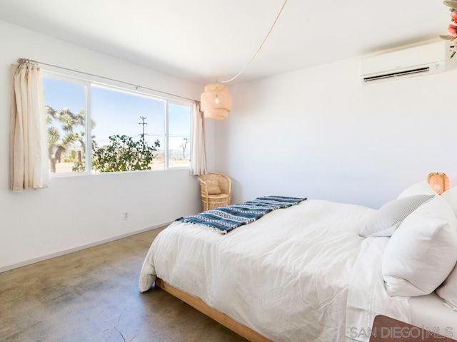 bedroom featuring carpet and a wall mounted AC