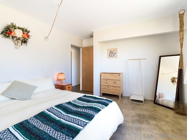 bedroom with concrete flooring