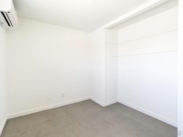 empty room featuring a wall mounted air conditioner