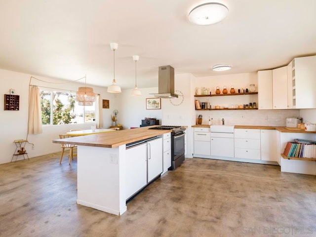 kitchen featuring white cabinets, stainless steel gas range, and pendant lighting