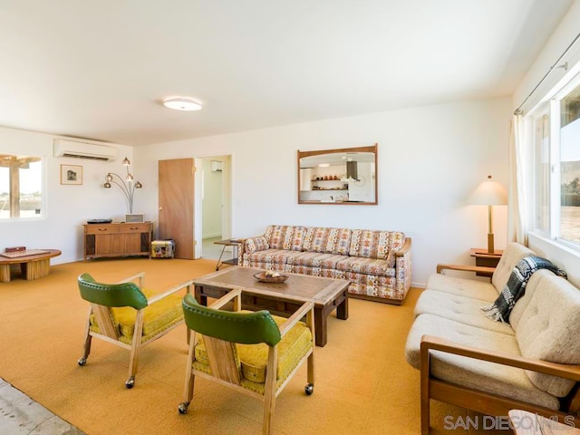 living room featuring light colored carpet and a wall mounted air conditioner