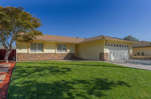 ranch-style house featuring a front yard and a garage