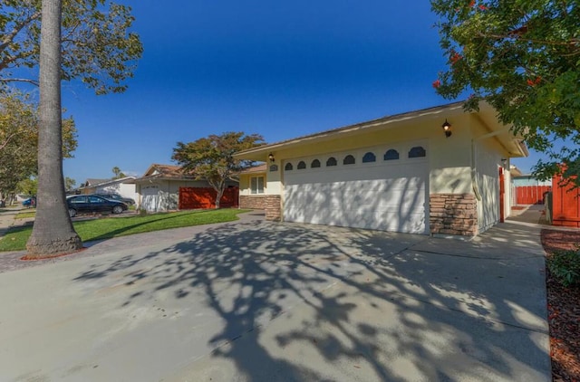 view of front of house with a garage and a front yard