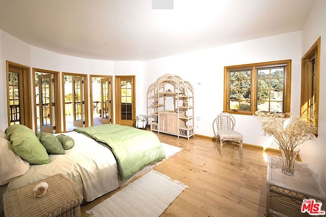 bedroom with light hardwood / wood-style flooring