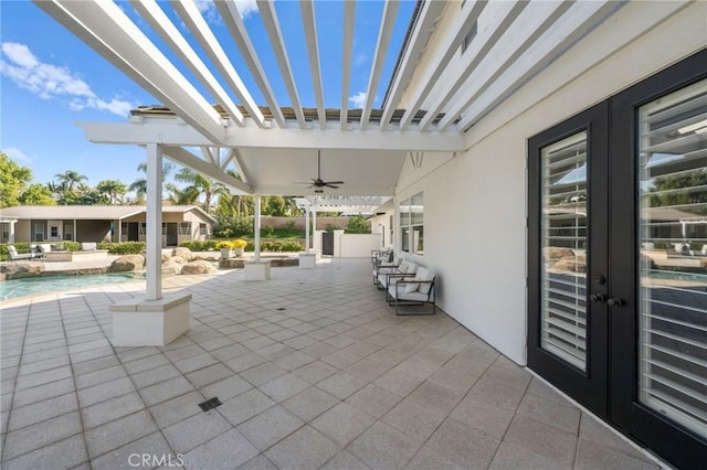 view of patio / terrace with a pergola, french doors, and ceiling fan