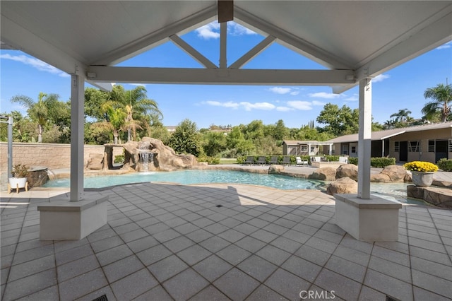 view of swimming pool featuring a patio and pool water feature