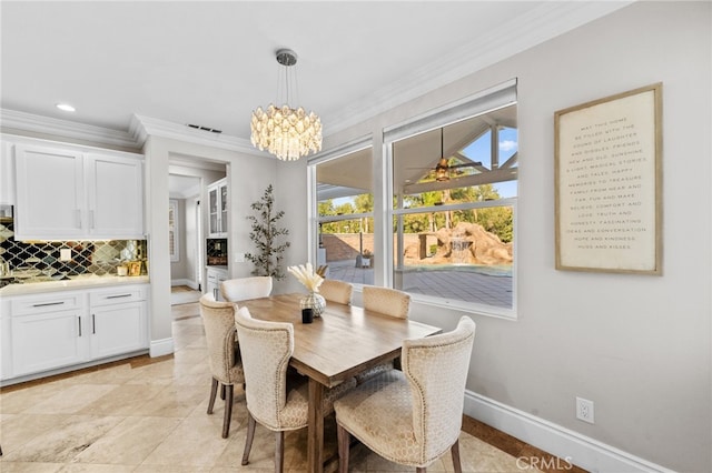 dining area featuring a notable chandelier and crown molding