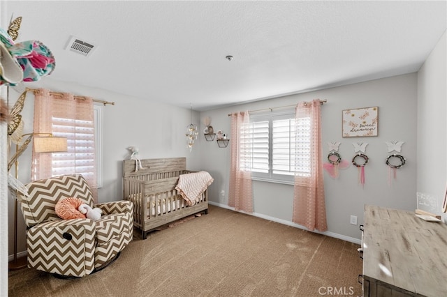 living area featuring a textured ceiling and carpet