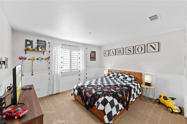 bedroom with light colored carpet