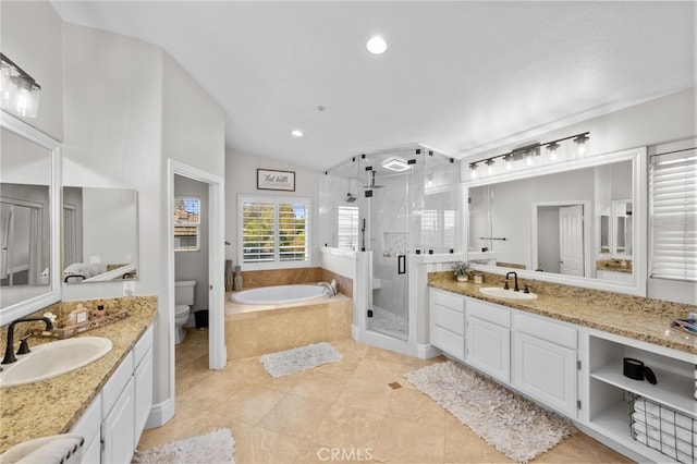 full bathroom with tile patterned flooring, vanity, vaulted ceiling, independent shower and bath, and toilet