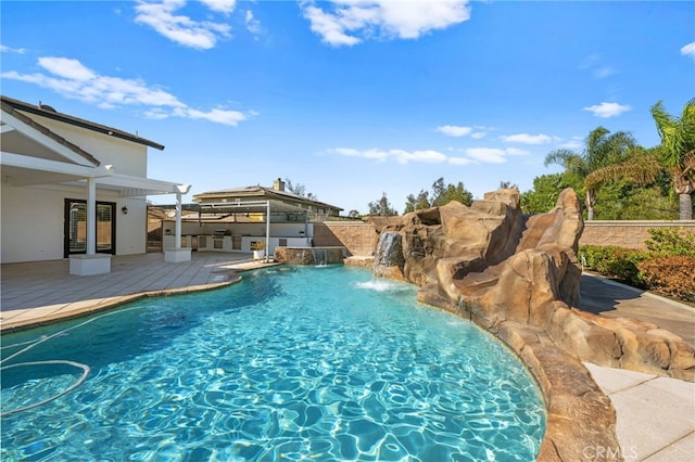 view of swimming pool with a gazebo, a patio area, and pool water feature