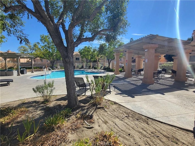 view of swimming pool featuring a pergola and a patio area