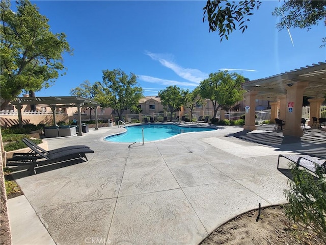 view of pool with a patio area and a pergola