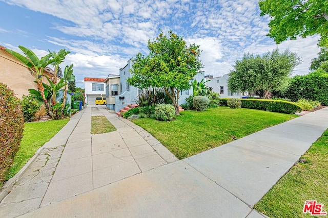 view of front of property with a front lawn