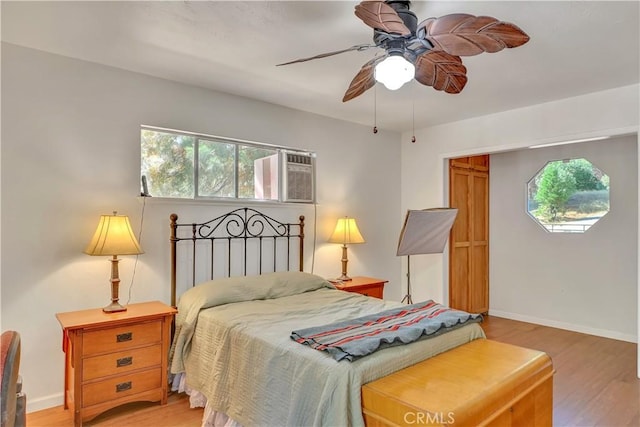 9226 La Porte Rd, Brownsville, CA 95919 - bedroom featuring a wall mounted air conditioner, light wood finished floors, baseboards, and ceiling fan