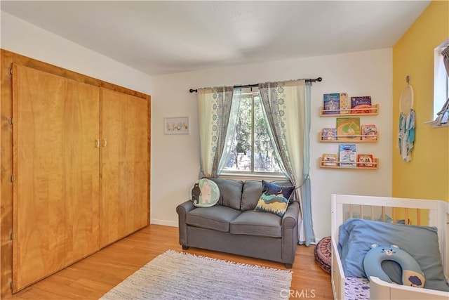 sitting room with light hardwood / wood-style flooring