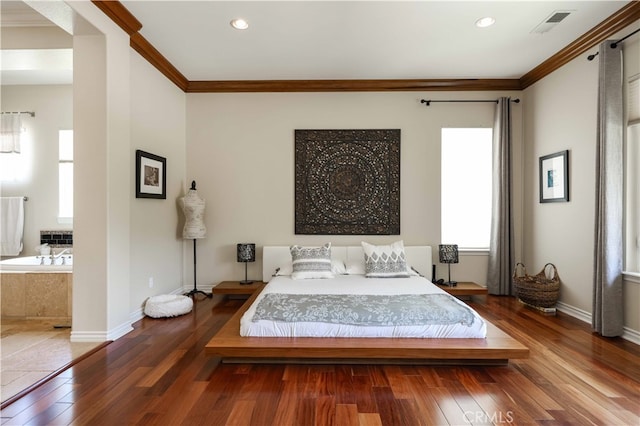 bedroom featuring multiple windows, crown molding, and dark hardwood / wood-style flooring