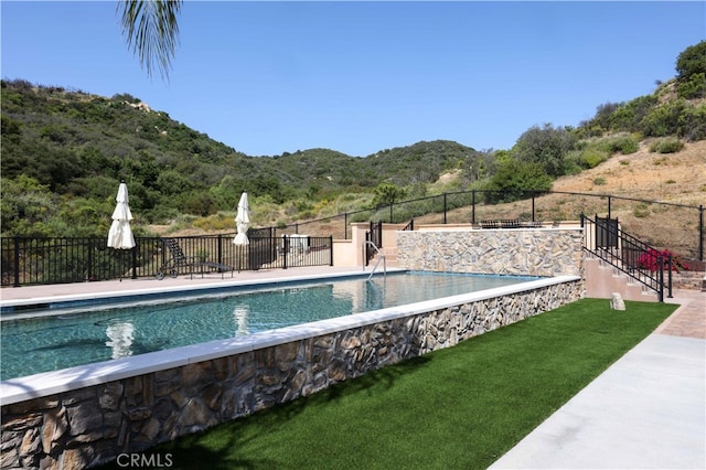 view of pool with a mountain view