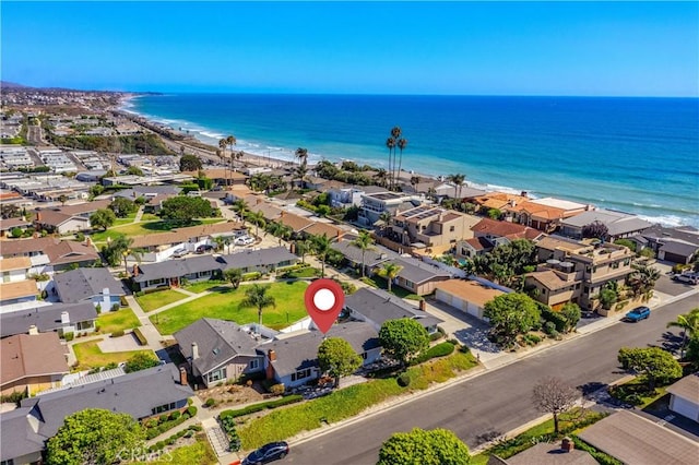 birds eye view of property featuring a view of the beach and a water view