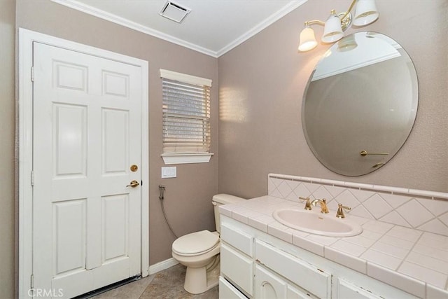 bathroom featuring tile patterned floors, crown molding, toilet, decorative backsplash, and vanity