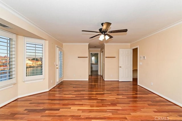 empty room featuring ceiling fan, light hardwood / wood-style floors, and ornamental molding