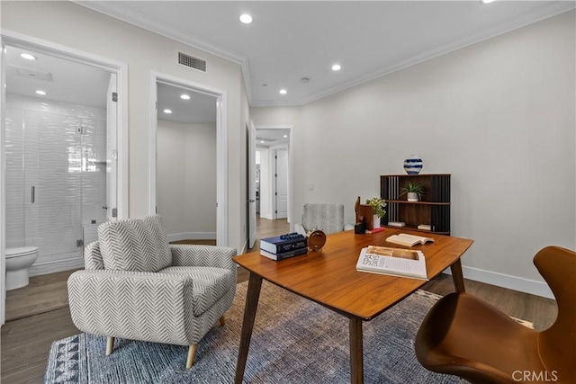 office space with wood-type flooring and crown molding