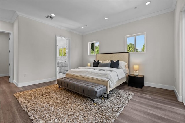 bedroom with wood-type flooring, connected bathroom, and crown molding