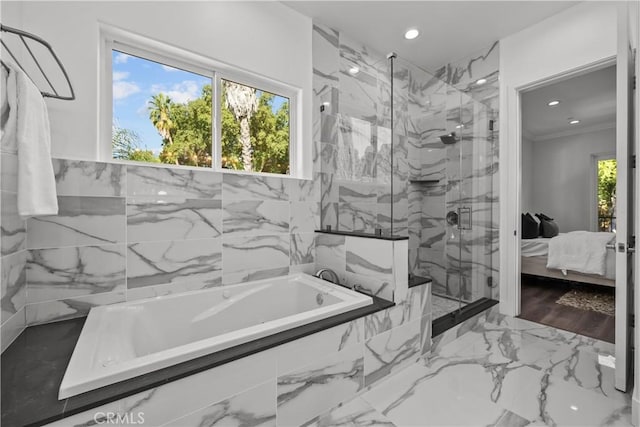 bathroom with wood-type flooring, independent shower and bath, and crown molding