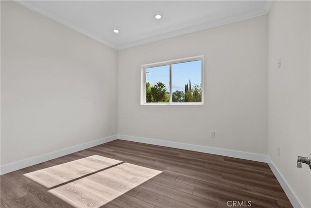 unfurnished room with crown molding and dark wood-type flooring