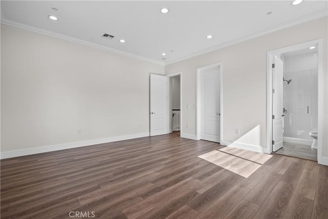 unfurnished bedroom featuring ensuite bath, crown molding, and dark hardwood / wood-style floors