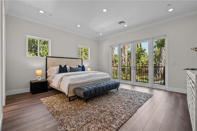 bedroom with access to exterior, light wood-type flooring, multiple windows, and ornamental molding